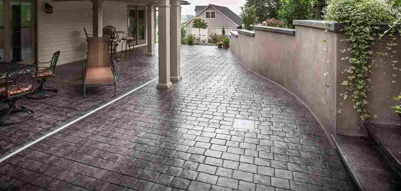 Decorative Stamped Concrete Patio and Walkway Mimicking Stone Pavers in Calgary, AB<br />
